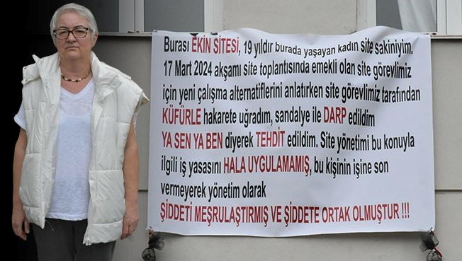 Apartman görevlisi saldırdı: Sesini duyurmak için pankart astı